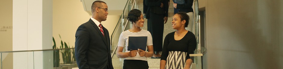 Admissions banner students on stairwell